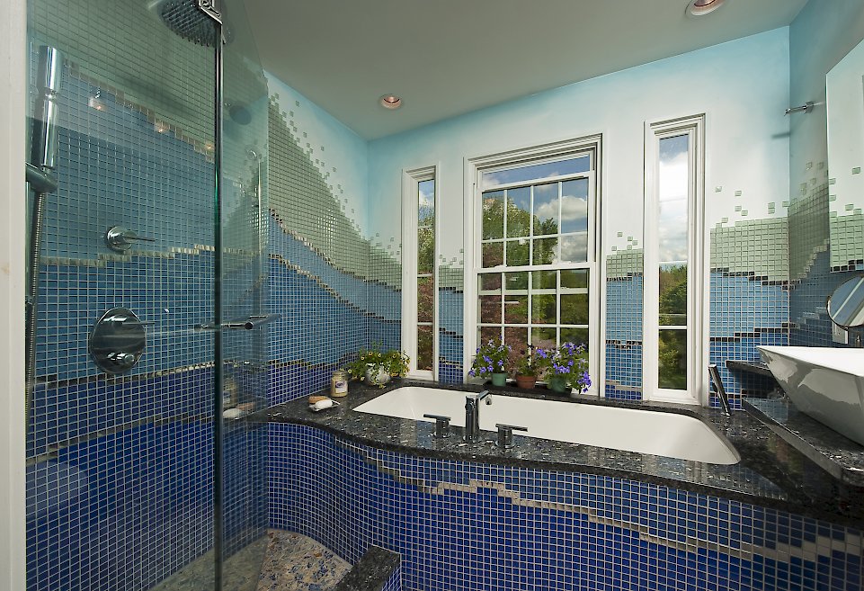 Multi-colored custom tiled bathroom.