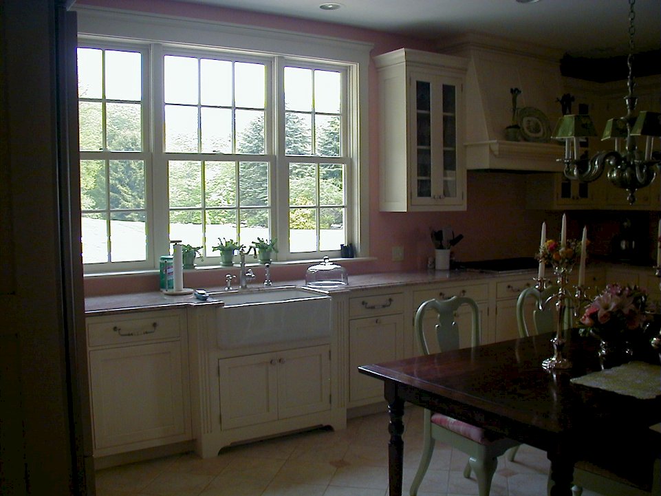 A white Wood-Mode kitchen with a Lancaster recessed flush inset door style.