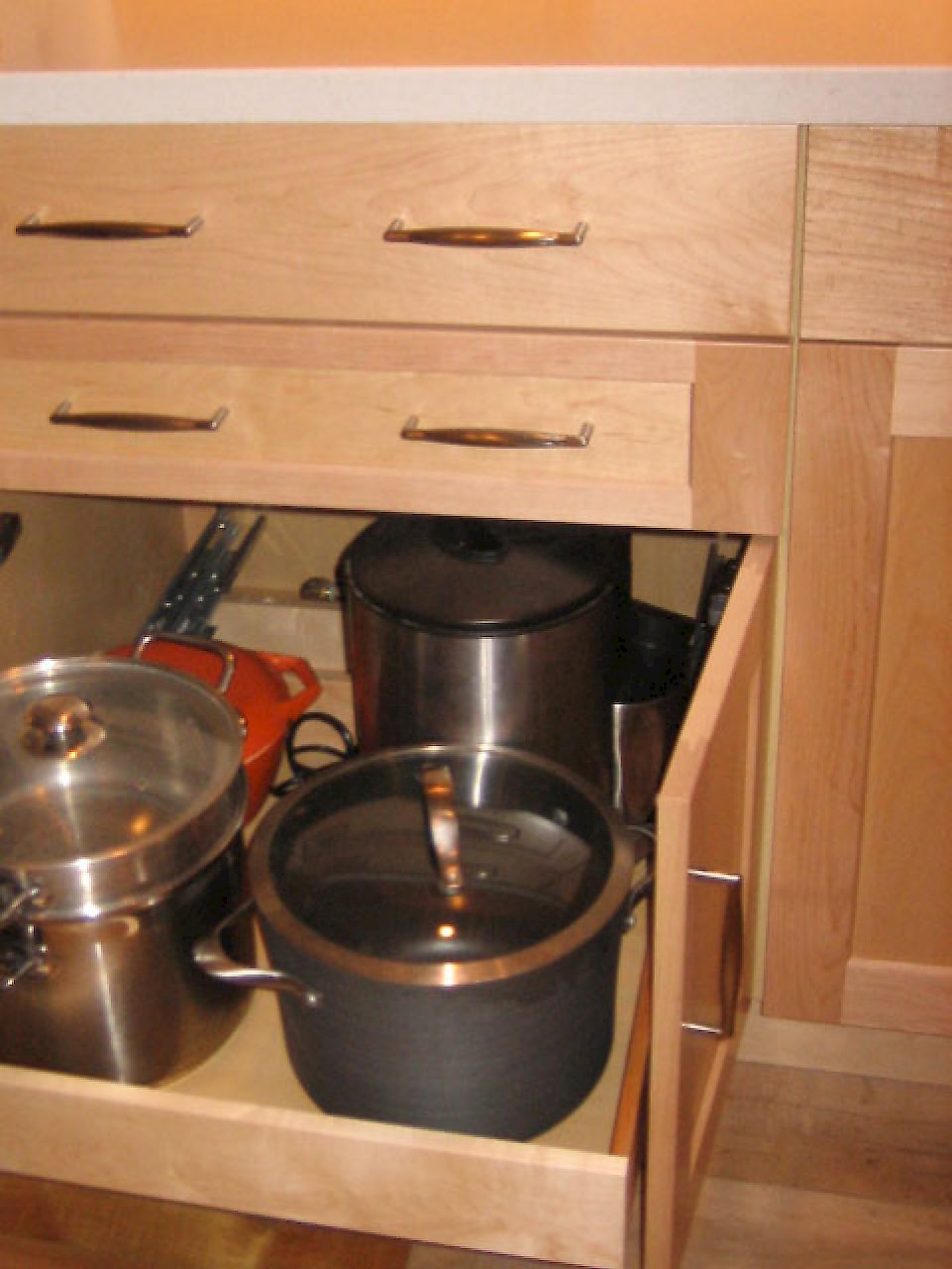 Pull out drawer for large pots and pans.