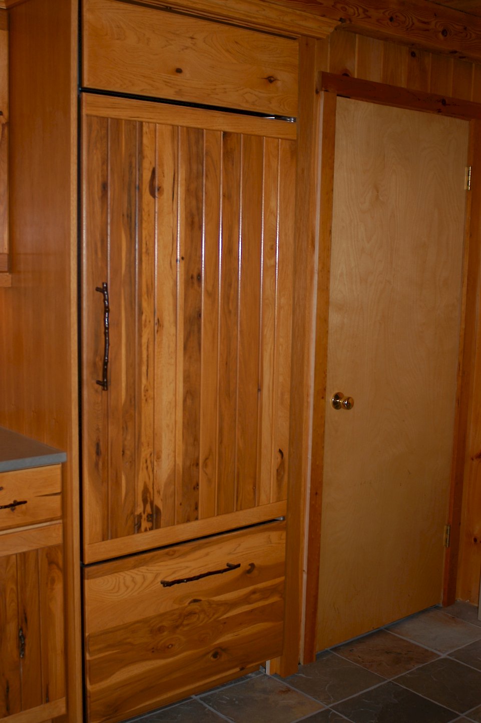 Custom hickory panels on the refrigerator.