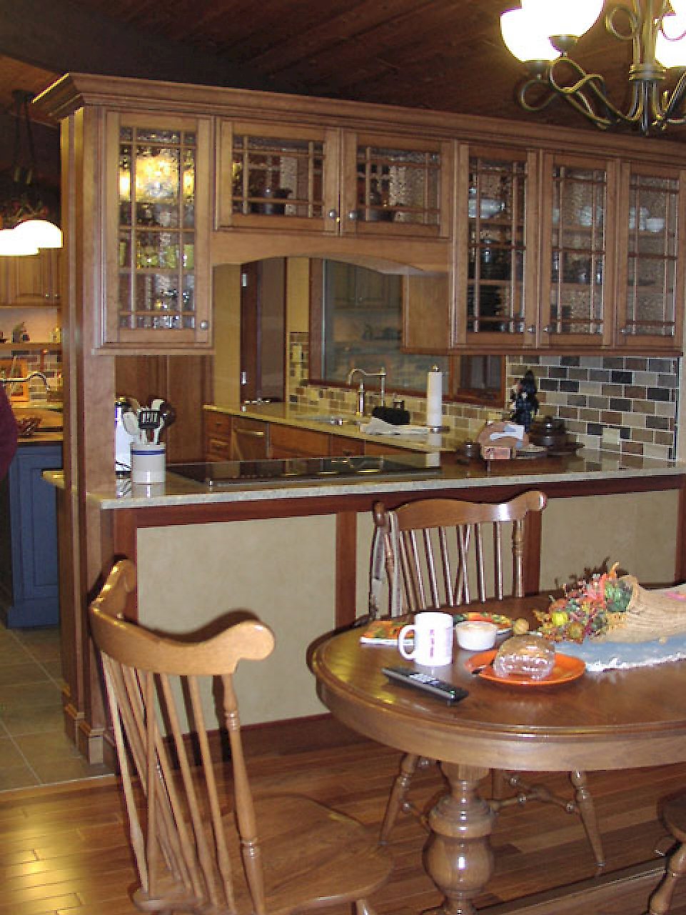 View of the kitchen peninsula with an electric cooktop.
