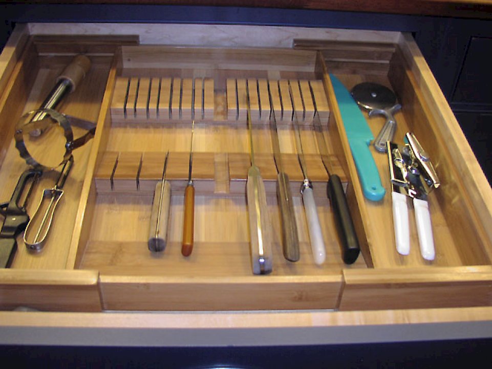 The maple knife holder in the cabinet.