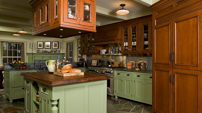 Wood-Mode Kitchen with an essex recessed door style, and custom green paint.