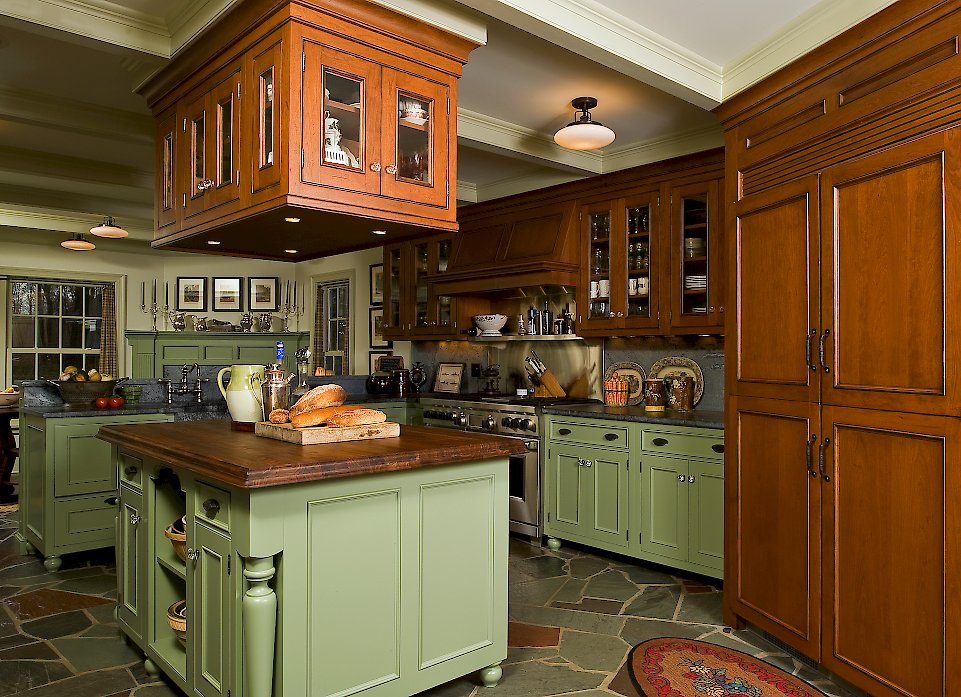 Wood-Mode Kitchen with an essex recessed door style, and custom green paint.