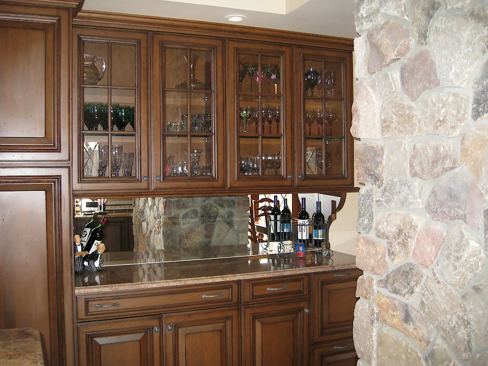 Wine Glass storage and a mirrored back-splash.